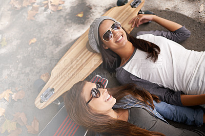 Buy stock photo Fashion, friends and above of women with skateboard for exercise, training and competition in city. Skate park, happy and young people in trendy, casual and street style for sports, hobby and fitness