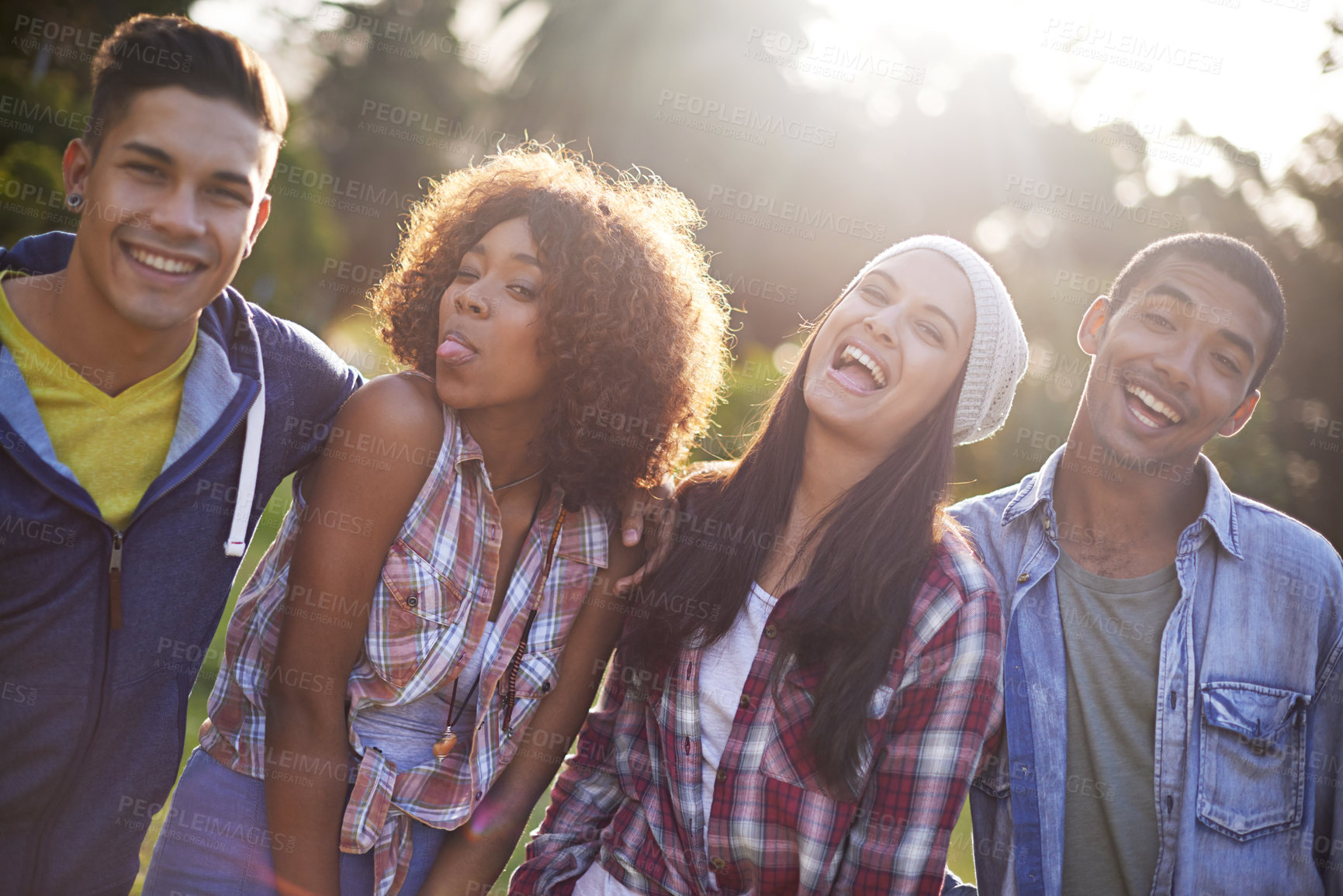 Buy stock photo Friends, portrait and smile in nature for adventure, vacation and weekend break in outdoors. Happiness, lens flare and face of diverse group of people in sunshine for bonding, holiday and travel
