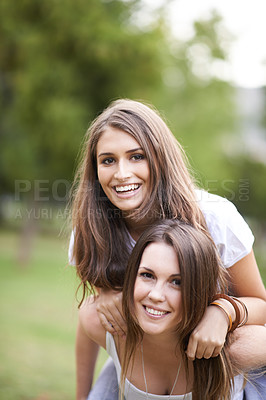 Buy stock photo Portrait, happy and couple of friends with piggyback ride for bonding, adventure and summer vacation in outdoor. Smile, relax and woman carrying lady for fresh air, support and quality time together