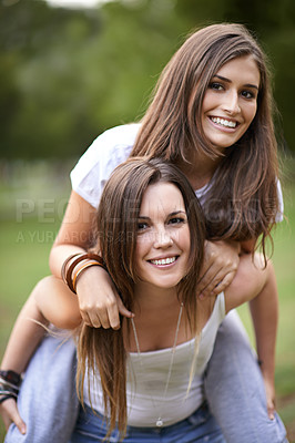 Buy stock photo Portrait, smile and couple of friends with piggyback ride for bonding, adventure and summer vacation in outdoor. Happy, relax and woman carrying lady for fresh air, support and park together