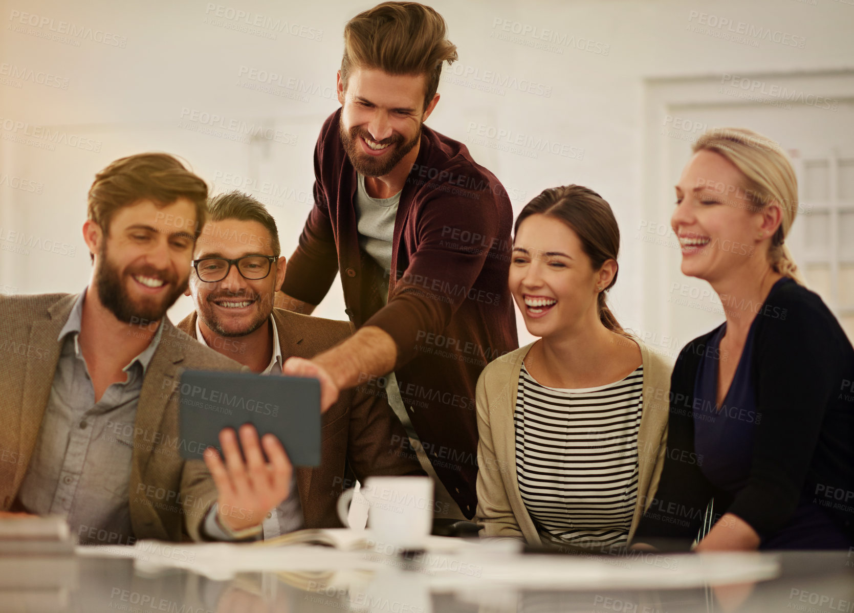 Buy stock photo Business, people and discussion with tablet in workplace, creative agency and laughing for social media meme. Online, schedule and happy conversation for comic email, teamwork and collaboration