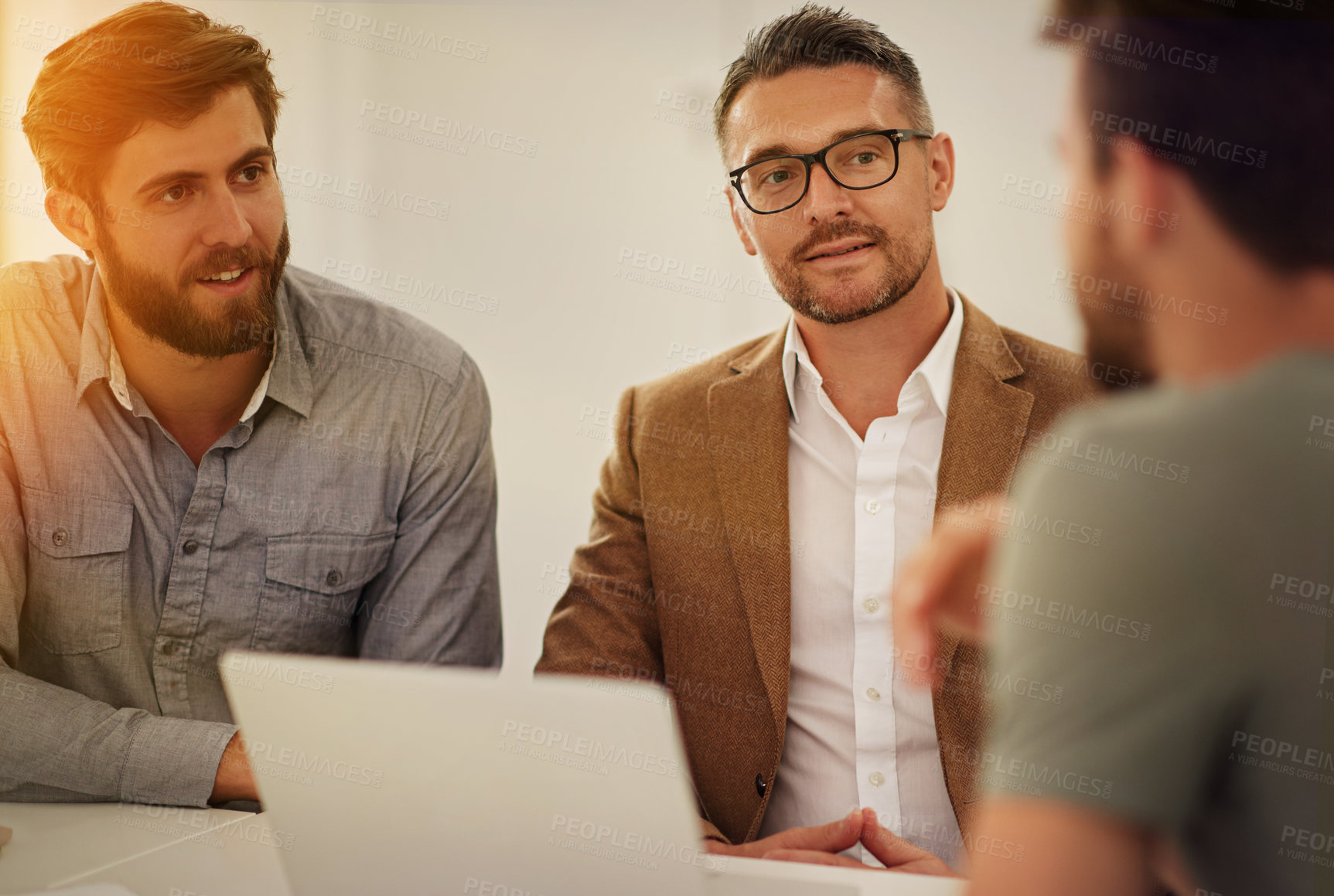 Buy stock photo Cropped shot of three businessmen in the boardroom