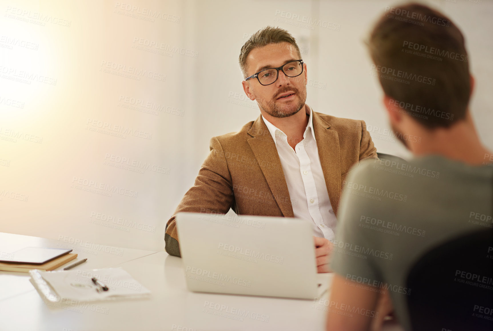 Buy stock photo Businessman, laptop and interview conversation with candidate for recruitment, opportunity and job research in office. Hr meeting, computer and hiring discussion for vacancy, onboarding and online cv