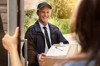 Buy stock photo Cropped shot of a young man making a delivery to a woman at her home