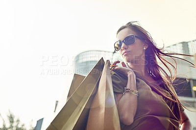 Buy stock photo A stylish young woman out shopping in the city