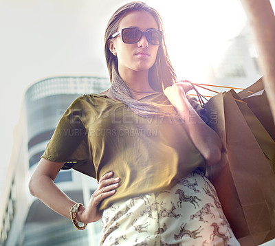 Buy stock photo Shopping bag, city portrait and confident woman with fashion clothes purchase, retail product or store discount. Pride, sales spree and chic female customer with sunglasses, luxury brand or mall gift