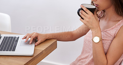 Buy stock photo A young woman working on her computer from home