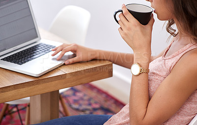 Buy stock photo A young woman working on her computer from home