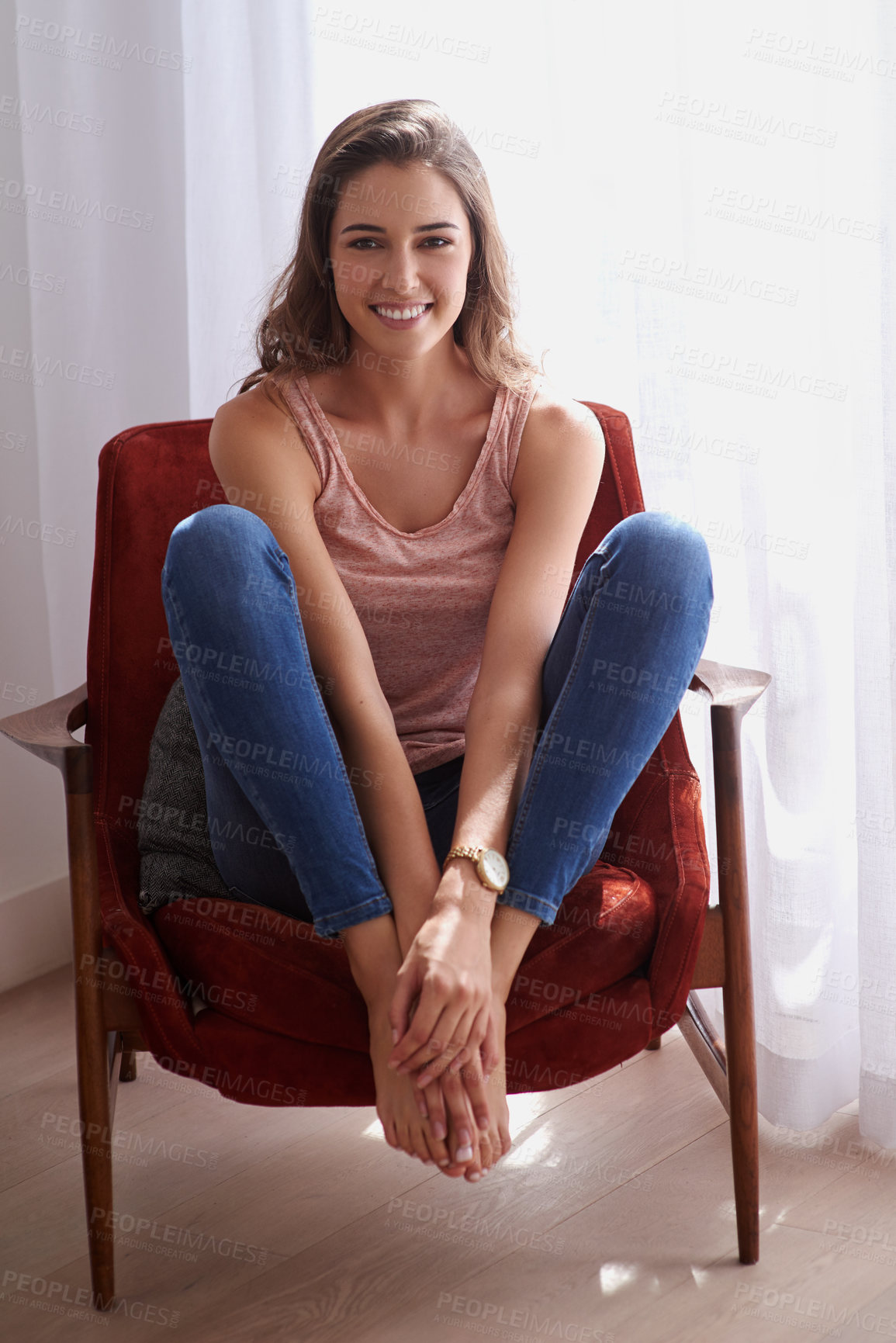 Buy stock photo Shot of an attractive young woman relaxing at home