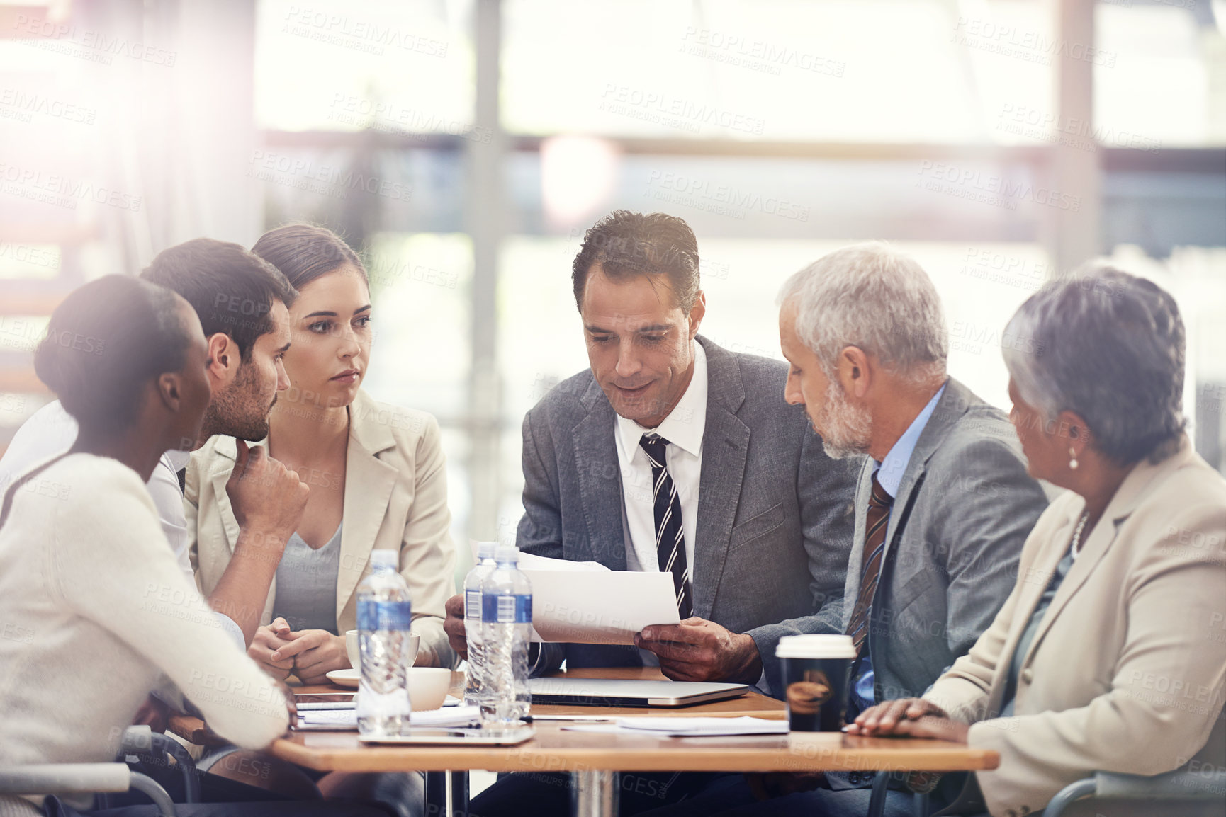 Buy stock photo Planning, talking and business people with a report in a meeting for financial strategy or investment. Teamwork, diversity and employees in accounting with paper for results on investing or economy