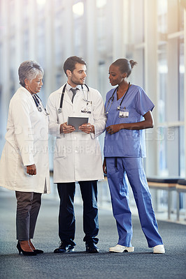 Buy stock photo Doctors, expert and team in hospital with tablet for online, discussion and health for medic and treatment. Diverse people or colleague with stethoscope for healthcare, medical and conversation

