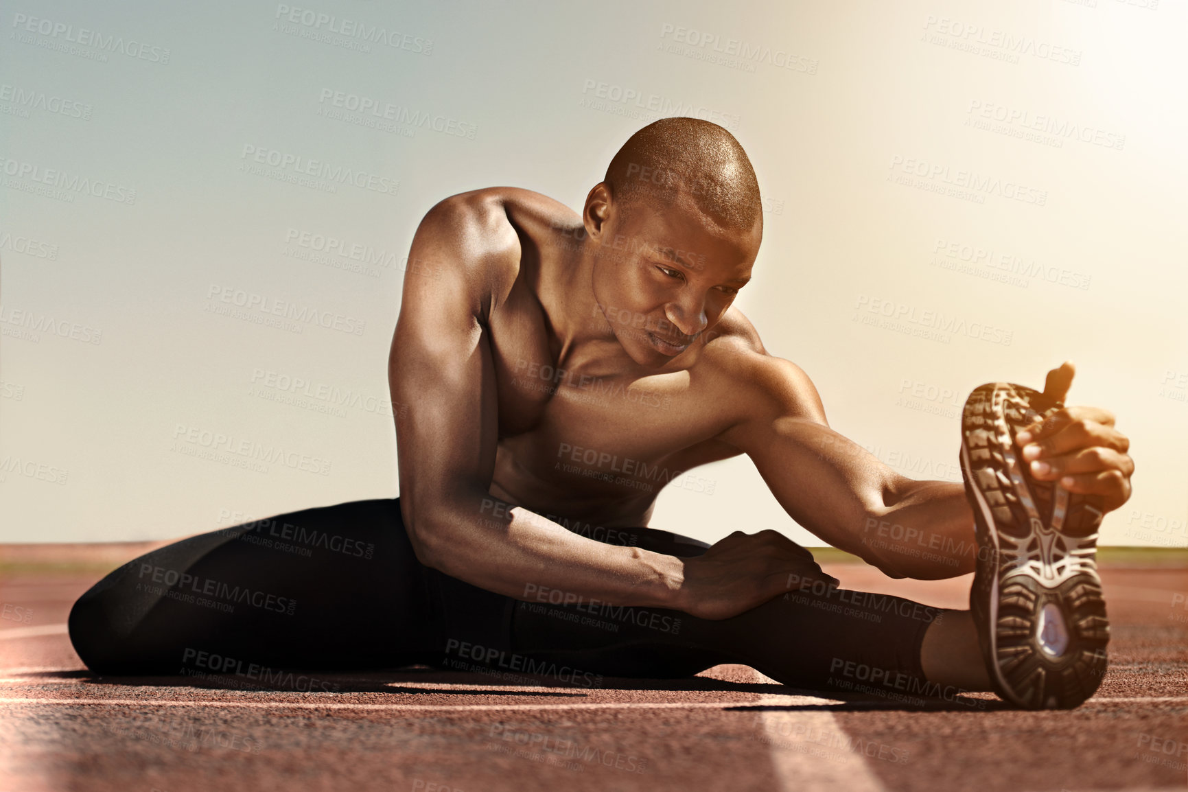 Buy stock photo An athlete stretching