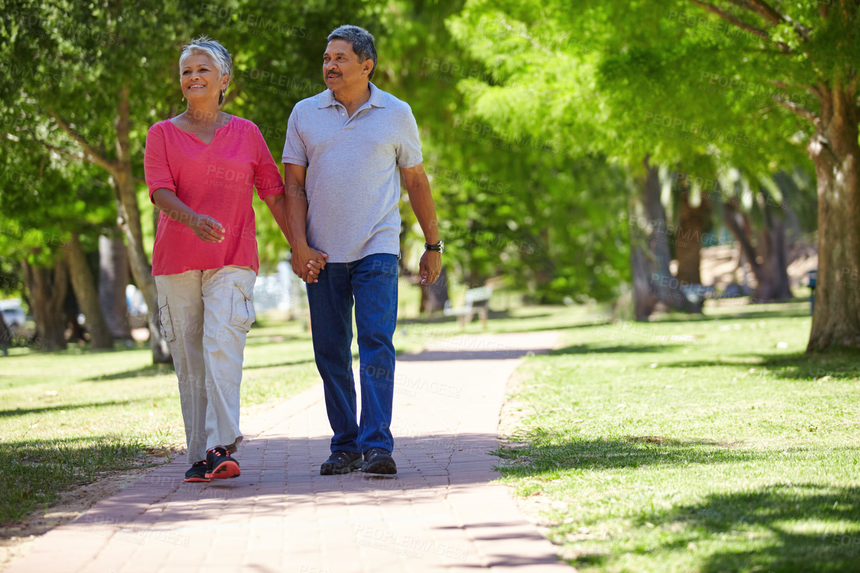 Buy stock photo Shot of a loving senior couple enjoying quality time together outdoors