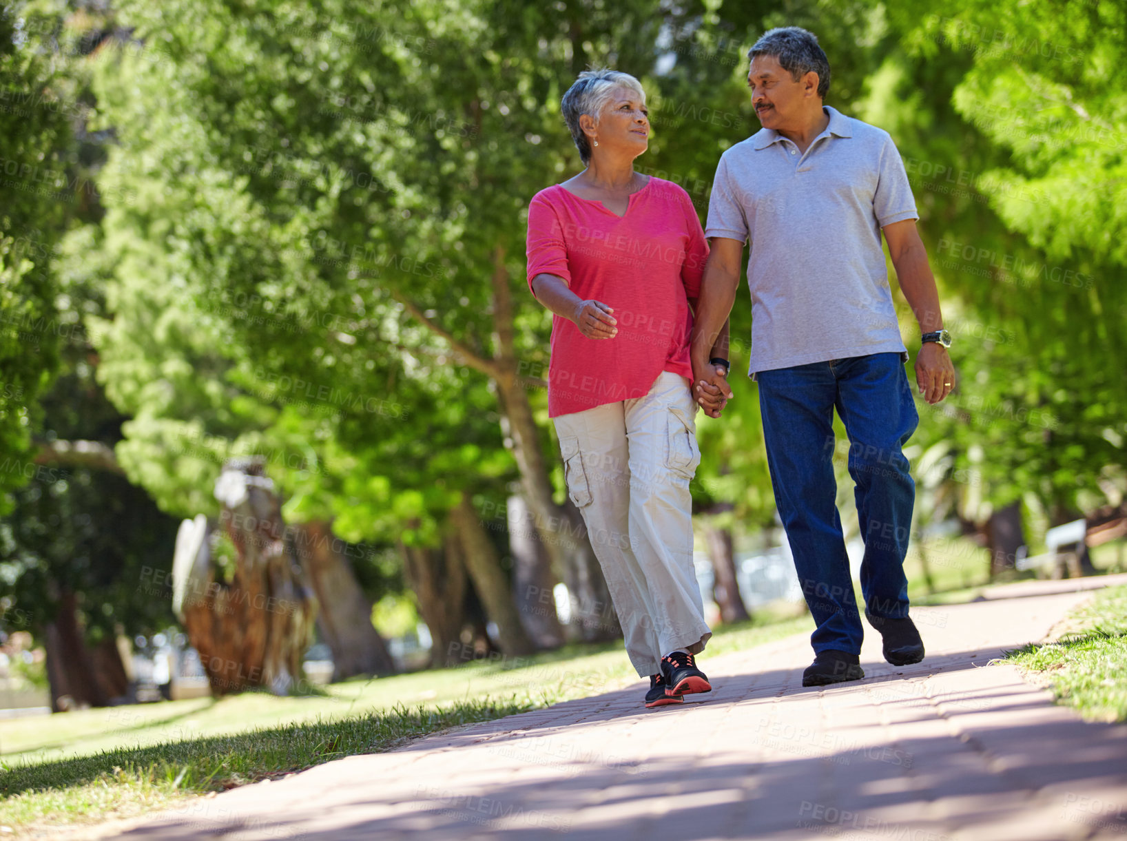 Buy stock photo Shot of a loving senior couple enjoying quality time together outdoors