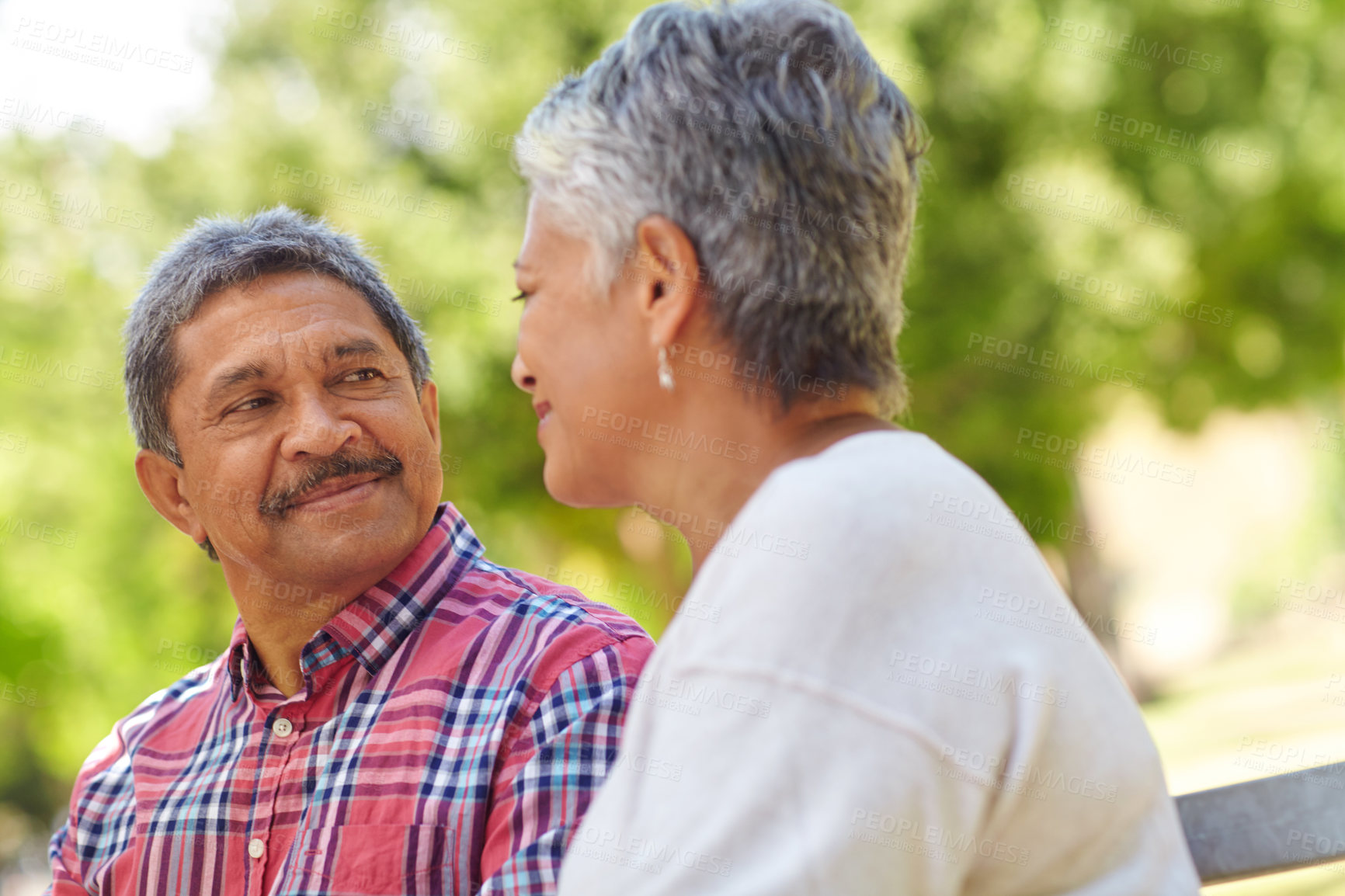 Buy stock photo Shot of a loving senior couple enjoying quality time together outdoors