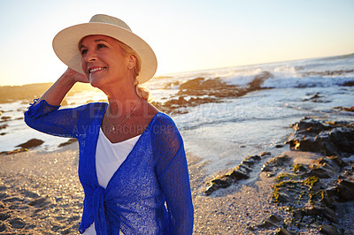 Buy stock photo Shot of a mature woman at the beach