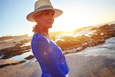 Buy stock photo Shot of a mature woman at the beach