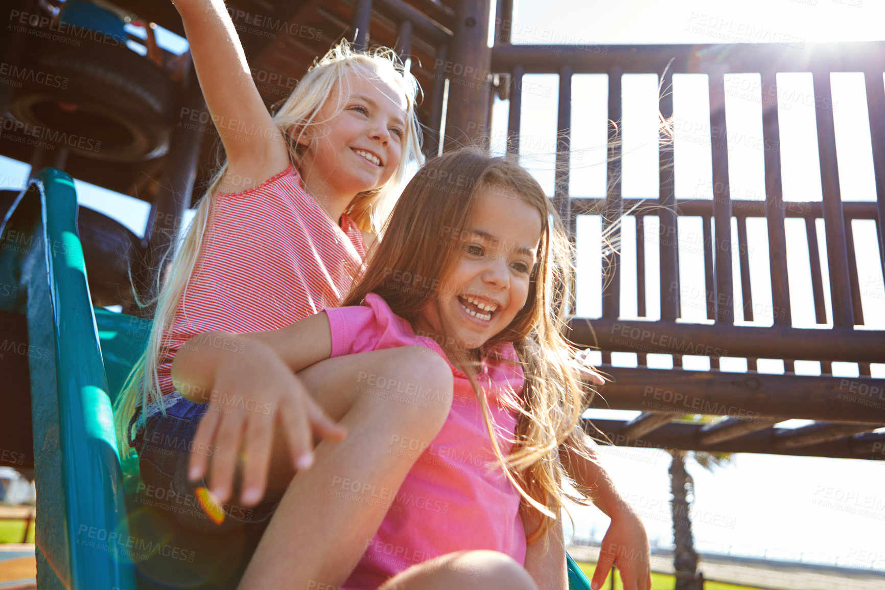 Buy stock photo Shot of little girls playing  on a jungle gym