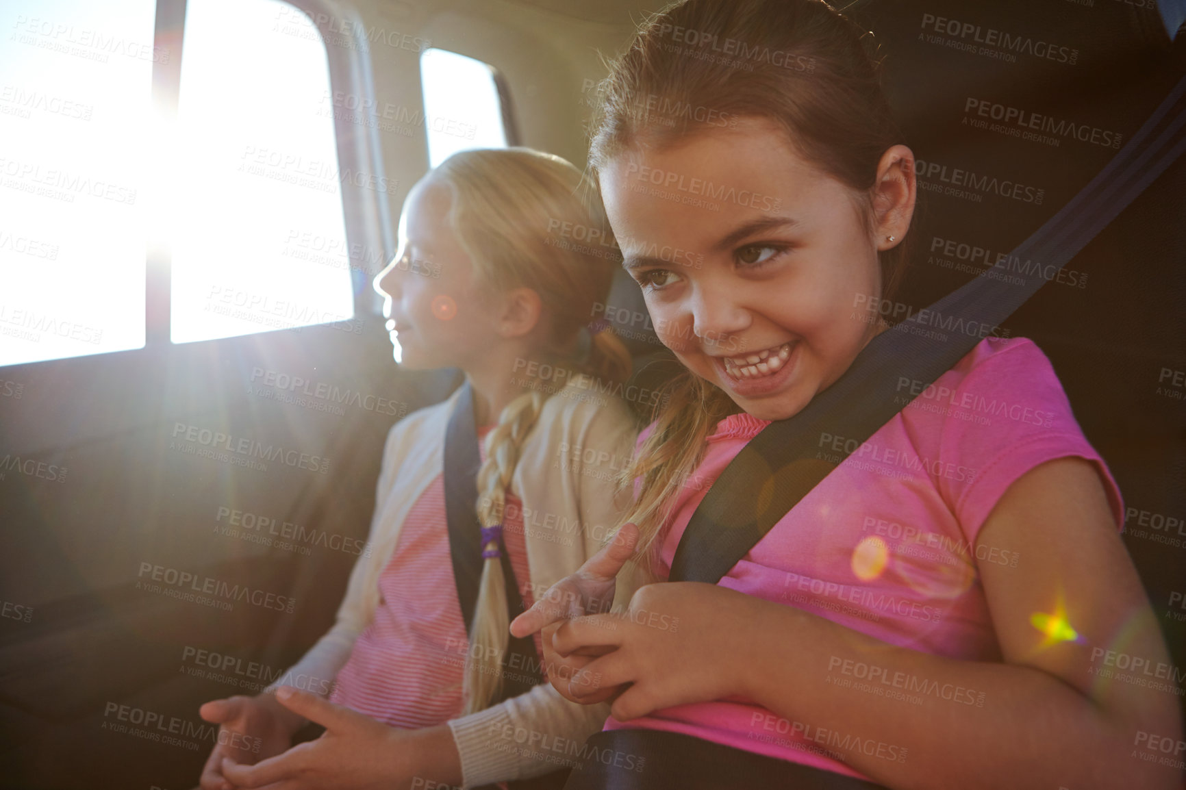 Buy stock photo Happy, children and travel in car for road trip with love, holiday adventure and bonding. Smile, kids and sisters relaxing in vehicle for transport, family connection and vacation journey for getaway