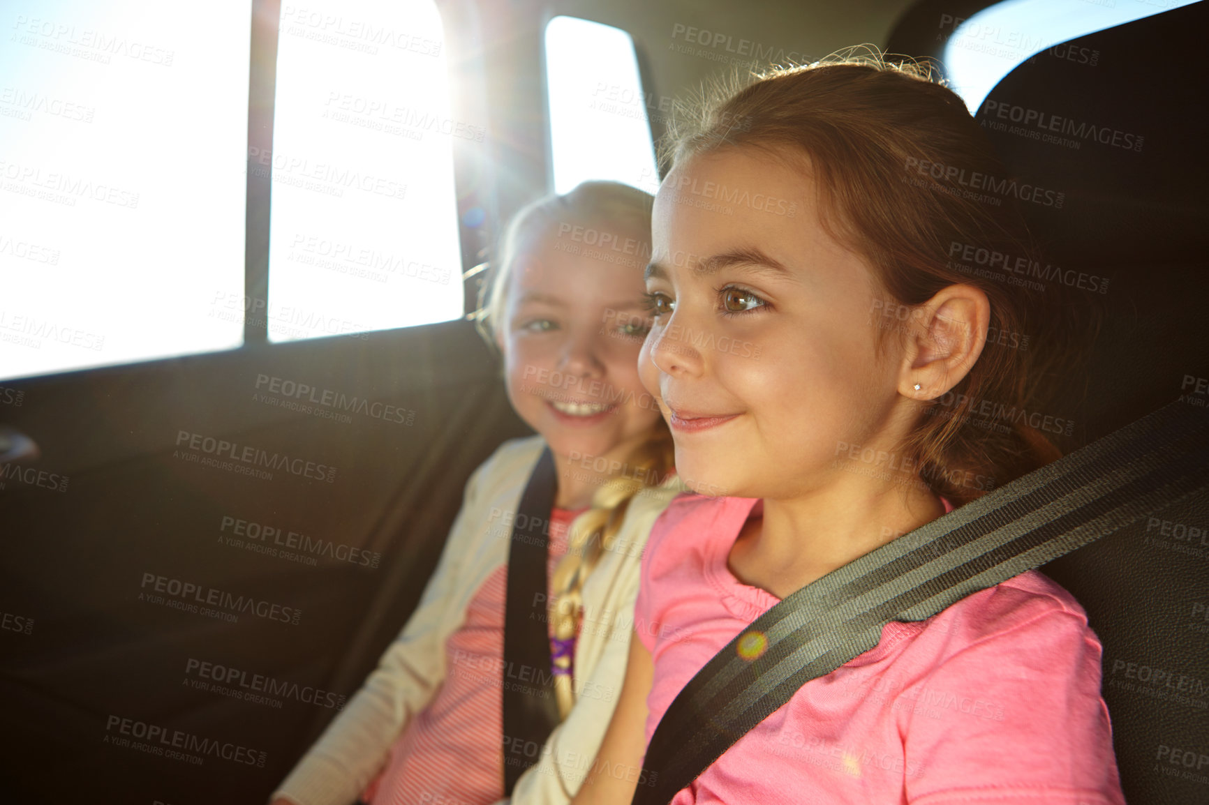 Buy stock photo Road trip, children and siblings in backseat of car for summer vacation, family time and journey for smile. Happy, flare and girls in vehicle together, travel holiday and weekend getaway for bonding