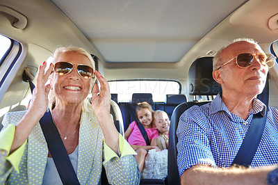 Buy stock photo Shot of two little girls going on a road trip with their grandparents