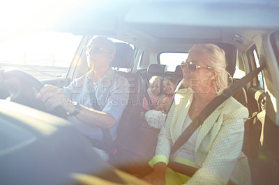 Buy stock photo Shot of two little girls going on a road trip with their grandparents