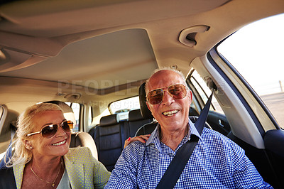 Buy stock photo Shot of a senior couple on a road trip