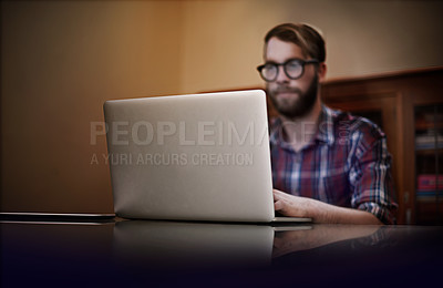 Buy stock photo Creative man, laptop and remote work with glasses for communication, networking or reading email at home. Male person or freelancer working and typing on computer for online startup at the house
