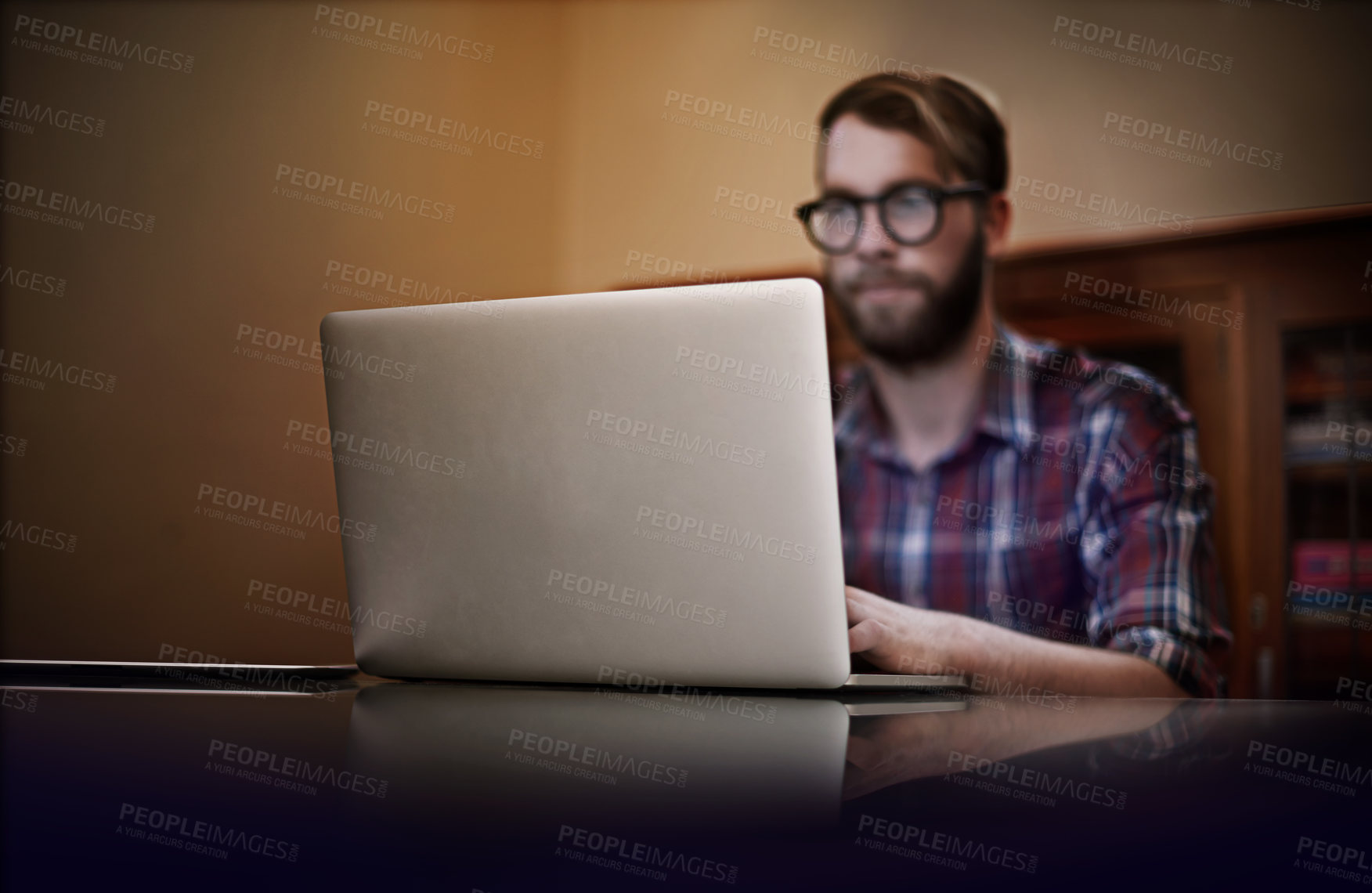 Buy stock photo Creative man, laptop and remote work with glasses for communication, networking or reading email at home. Male person or freelancer working and typing on computer for online startup at the house