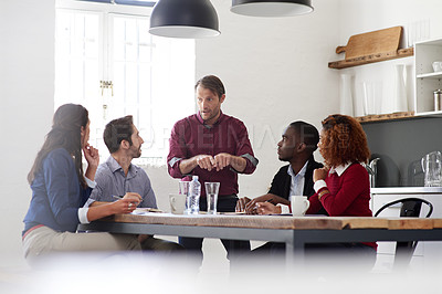 Buy stock photo Cropped shot of young designers discussing work together in an office