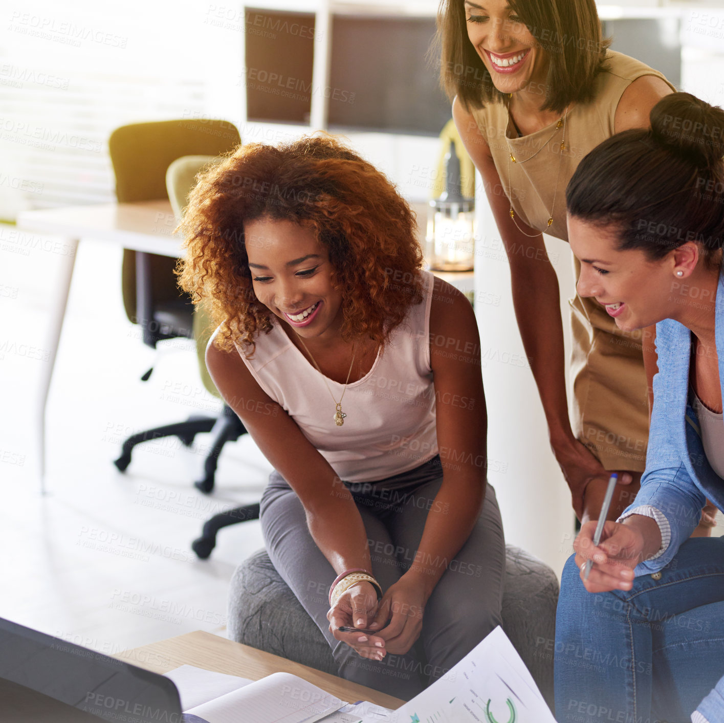 Buy stock photo Shot of three businesswomen working together in an office