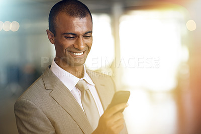 Buy stock photo Phone, reading and business man smile for communication, networking with client or social media in legal career. Cellphone, typing or online search of corporate indian person or lawyer in light leak