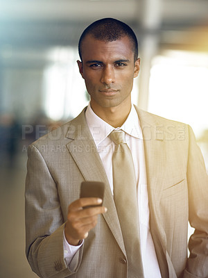 Buy stock photo Cropped portrait of a businessman sending a text message