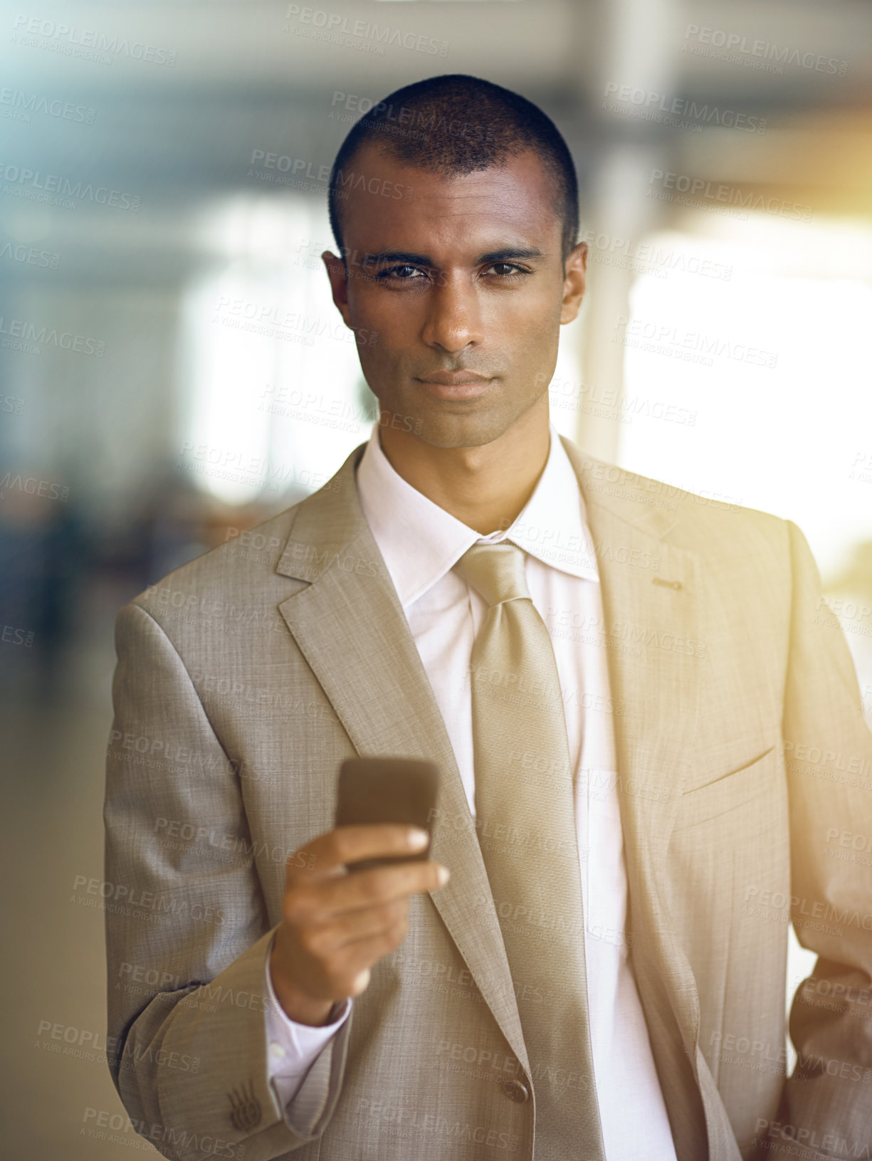 Buy stock photo Cropped portrait of a businessman sending a text message