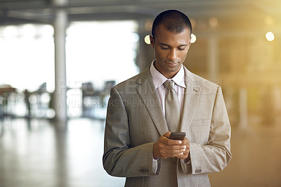 Buy stock photo Cropped shot of a businessman sending a text message