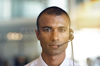 Buy stock photo Cropped portrait of a businessman communicating using his handsfree headset