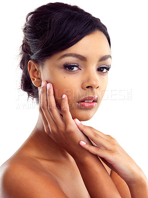 Buy stock photo Studio portrait of a young woman with perfect skin posing against a white background