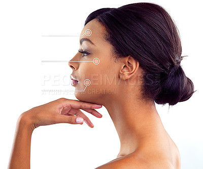 Buy stock photo Studio shot of a young woman with areas of her face highlighted