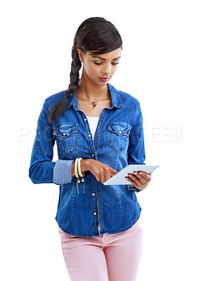 Buy stock photo Girl, typing and tablet in studio for fashion news, trends and update on cool style on white background. Person scroll, reading or surfing internet on digital tech for online magazine or clothes tips