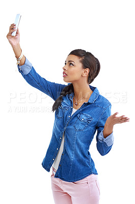 Buy stock photo Shot of a young woman searching for a cellphone signal isolated on white