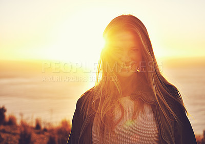 Buy stock photo Portrait of a woman standing on a hill top at sunset