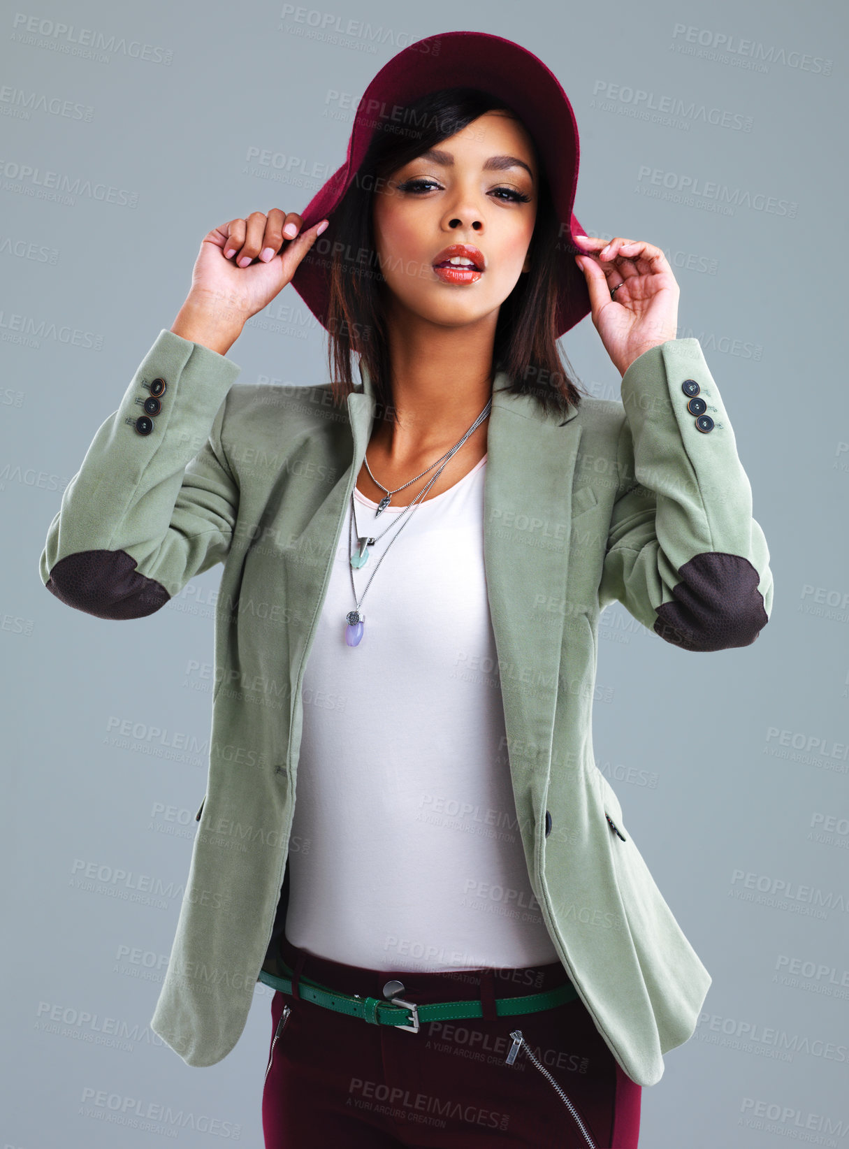 Buy stock photo Fashion, hat and portrait of woman in studio with trendy clothes, cool outfit and style. Confidence, attractive and isolated person with pride in jacket, cosmetics and accessory on gray background
