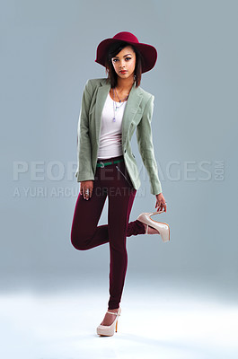 Buy stock photo Full length studio portrait of a fashionable young woman posing against a gray background