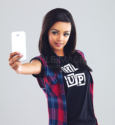 Buy stock photo Selfie, fashion and woman with smartphone in studio for photography, social media or profile picture on gray background. Smile, gen z and girl with mobile phone for edgy, trendy or stylish clothing