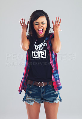 Buy stock photo Anger, scream and young woman for fashion, clothes and trendy outfit isolated on gray background, Gen z girl, face and confidence for outfit, y2k and cool streetwear for youth on studio backdrop