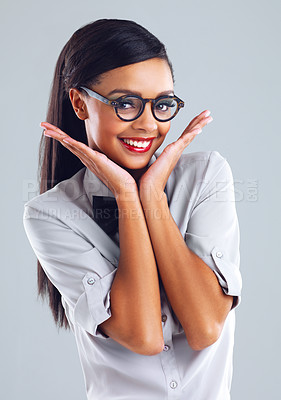 Buy stock photo Cropped portrait of a trendy young woman gesturing against a gray background