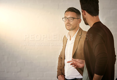 Buy stock photo Cropped shot of two businessmen having a conversation