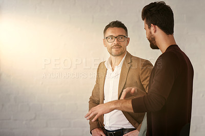 Buy stock photo Cropped shot of two businessmen having a conversation