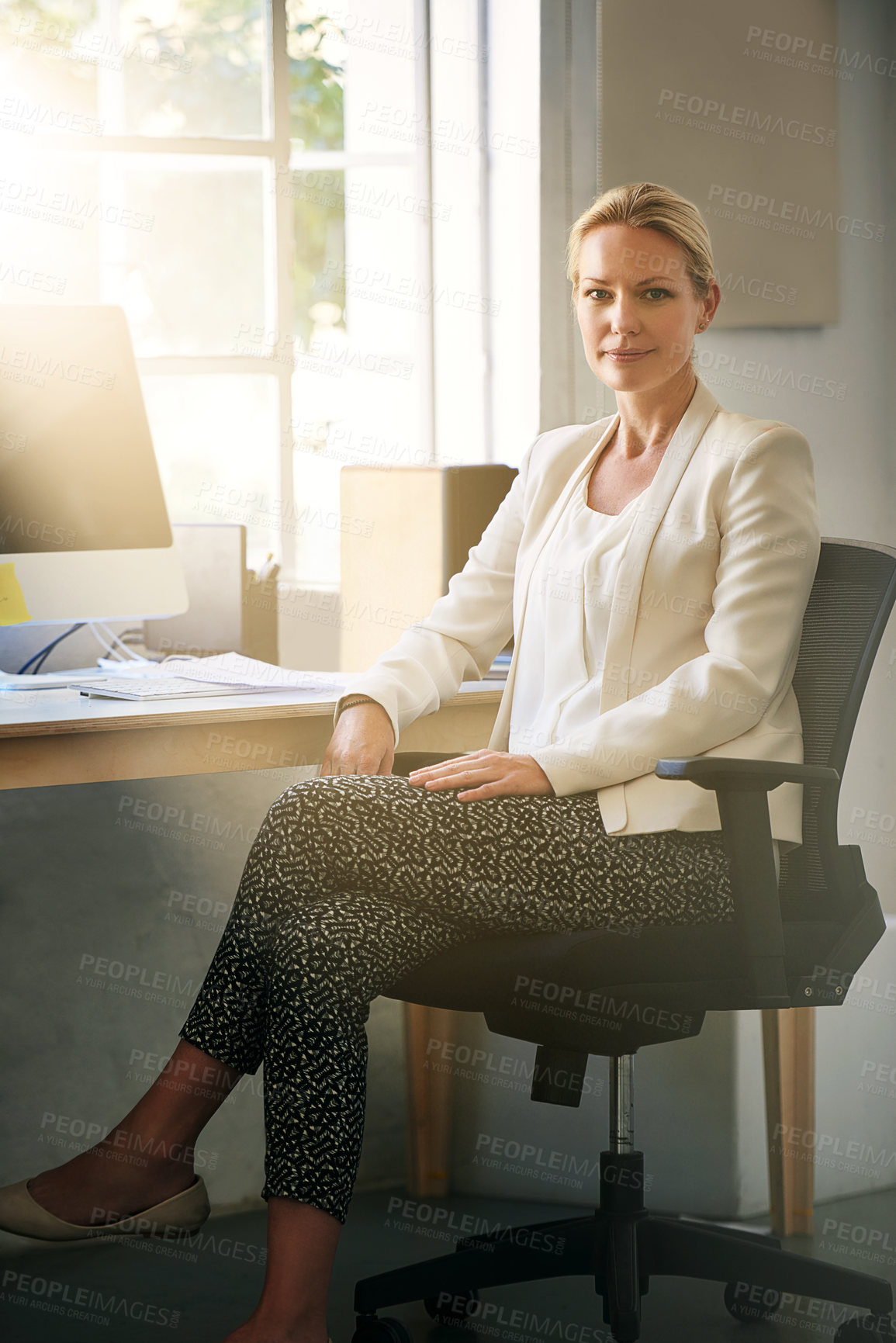 Buy stock photo Shot of a designer sitting in her office