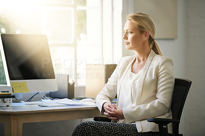 Buy stock photo Shot of a designer sitting in her office